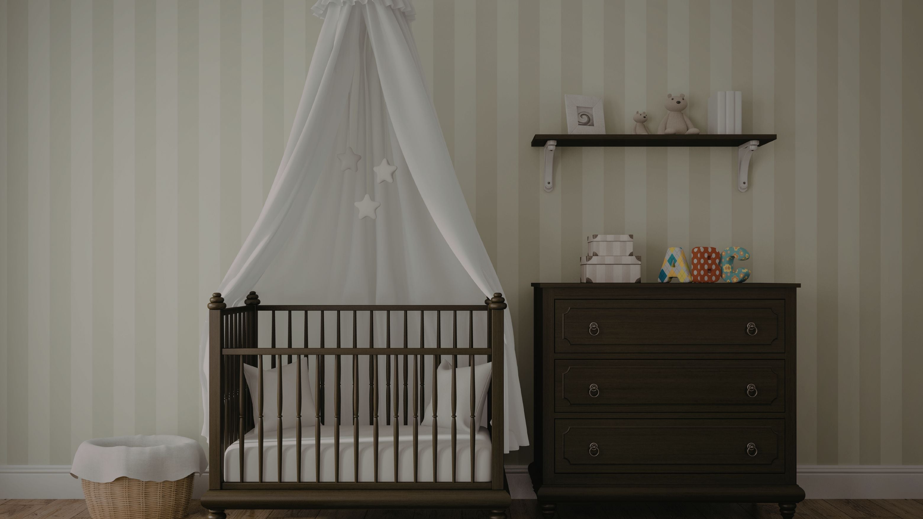 Nursery room with wooden crib and dresser against striped wallpaper